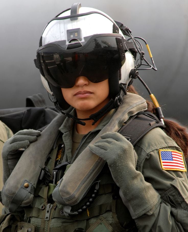 United States AI Solar System (11) - Page 16 Aviation-girl-Rocio-Britos-US-Navy-AWSO-2nd-Class-assigned-to-the-Dusty-Dogs-of-Helicopter-Anti-Submarine-Squadron-HS-7-waits-to-board-an-SH-60-Seahawk-on-board-Nimitz-class-aircraft-carrie.