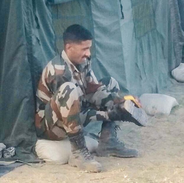An Army Jawan Polishing Shoes of his senior