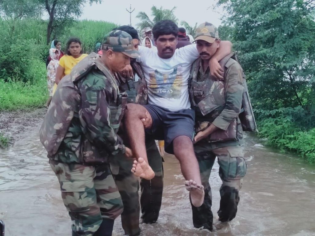 Soldiers evacuating injured local