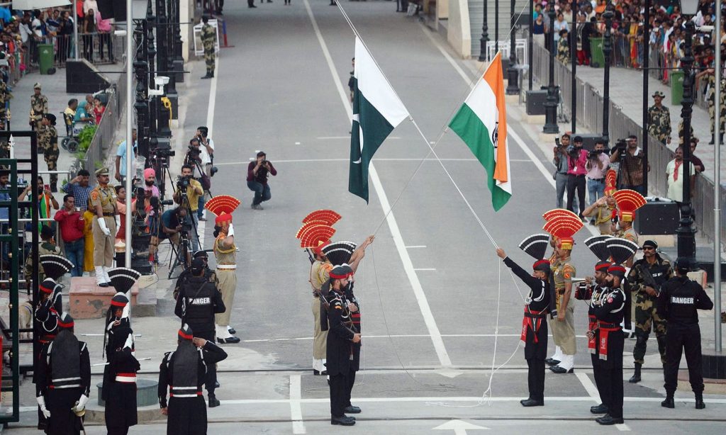 Pakistani Rangers and Indian Border Security Force personnel taking part in daily border retreat ceremony