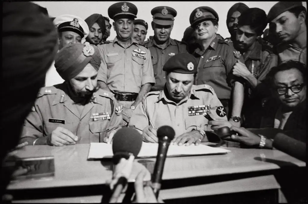 Pakisani commander Lt.Gen .A.A.K. Niazi signing the instrument of surrender Dec16 1971r