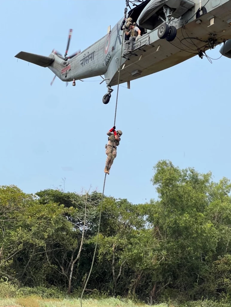 U.S. Naval Special Warfare operators conduct fast rope training with a CH-3 Sea King assigned to the Indian Marine Commando Flight during a joint training exercise. Naval Special Warfare is the nation's elite maritime special operations force, uniquely positioned to extend the Fleet's reach and gain and maintain access for the Joint Force in competition and conflict.