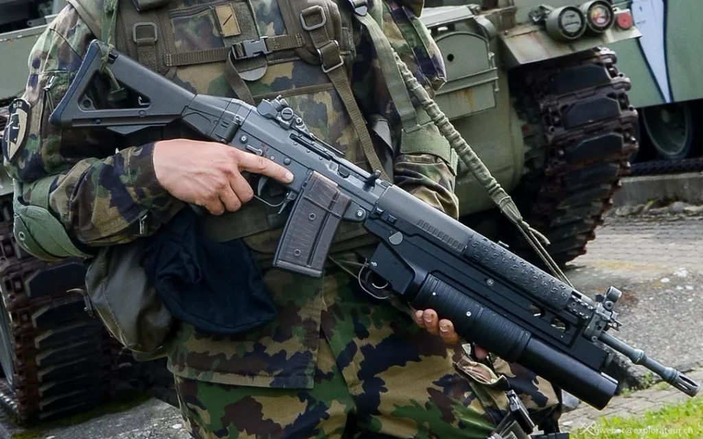 Swiss Army Soldier holding his Stgw 90 (SIG 550) equipped with a grenade launcher.