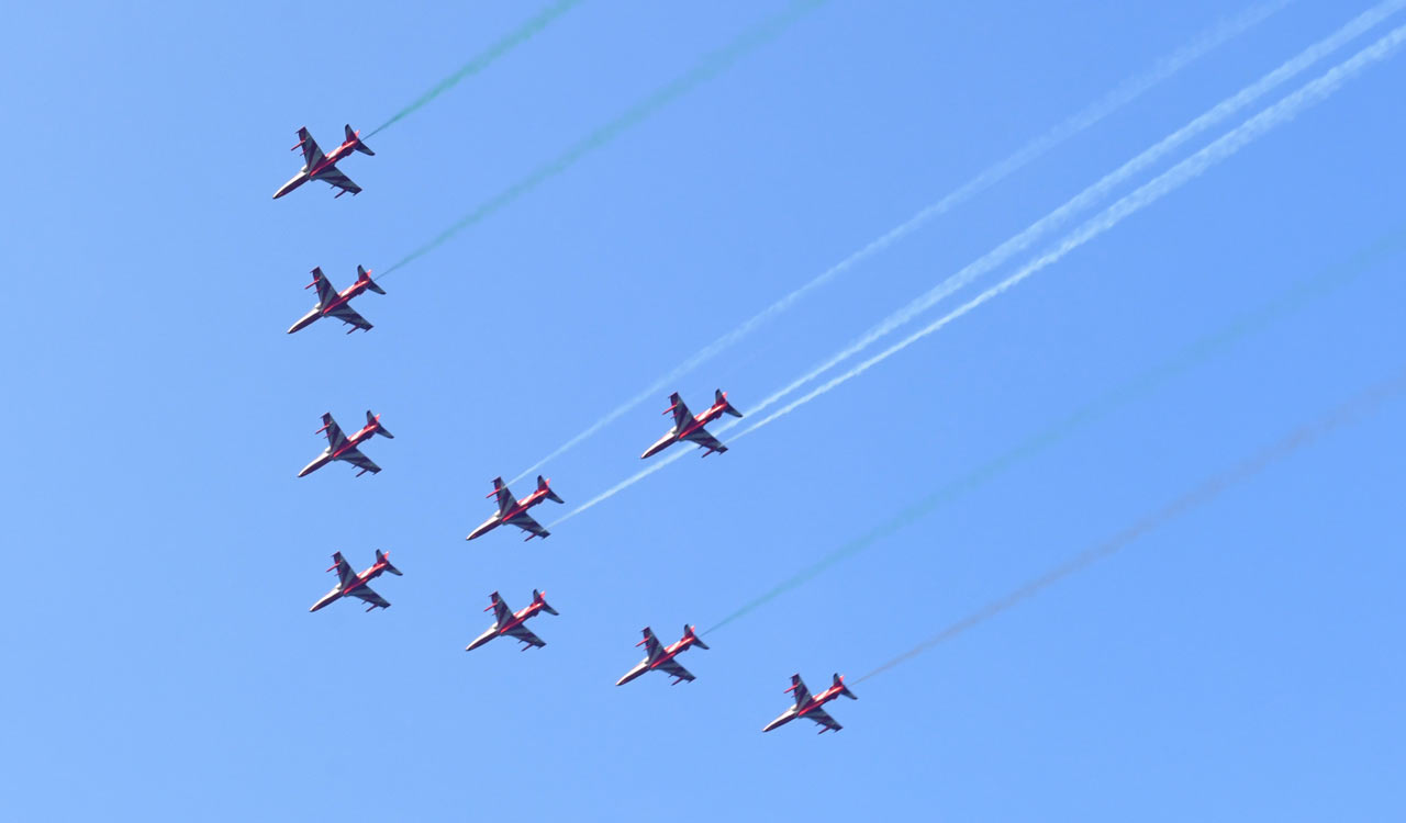 Suryakiran Aerobatic Team Delights Hyderabad with Thrilling Air Show over Hussain Sagar Lake