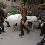 Jawans Carrying A Dead Person